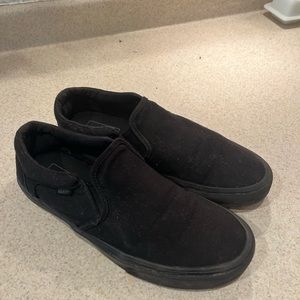 Black Vans slip ons